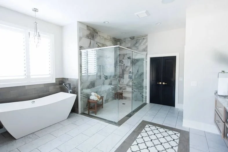Renovated bathroom with tiled shower, glass screen and vanity cabinetry