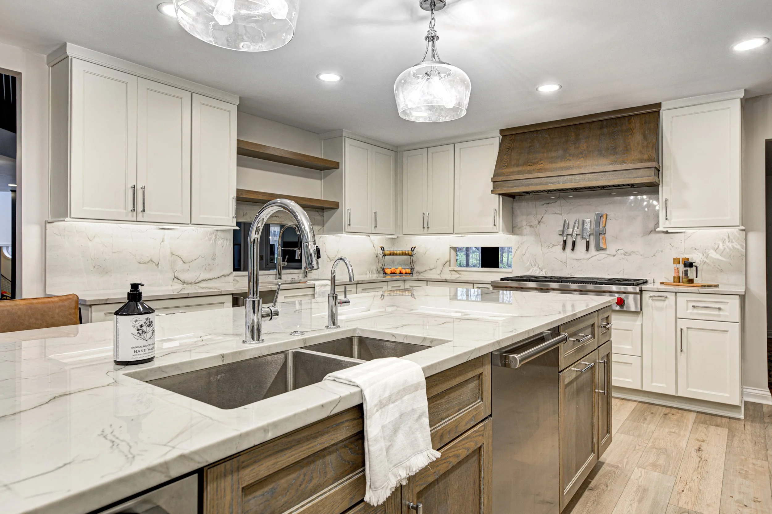 Open plan kitchen with a large island, timber cabinetry and pendant lighting