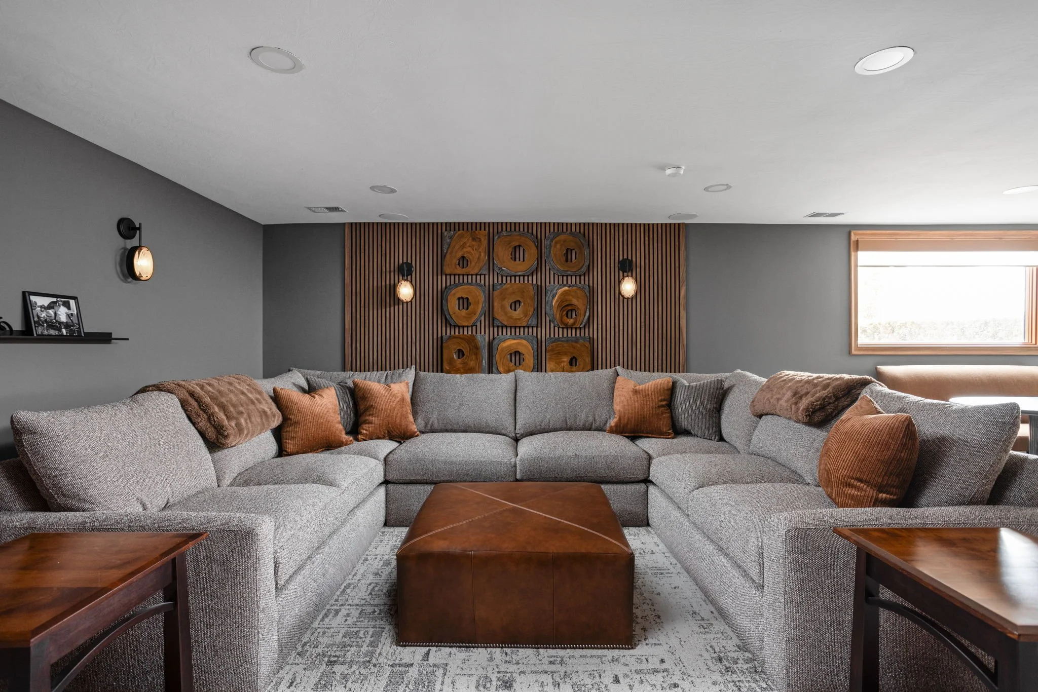 Living space with carefully proportioned furniture, art and lighting