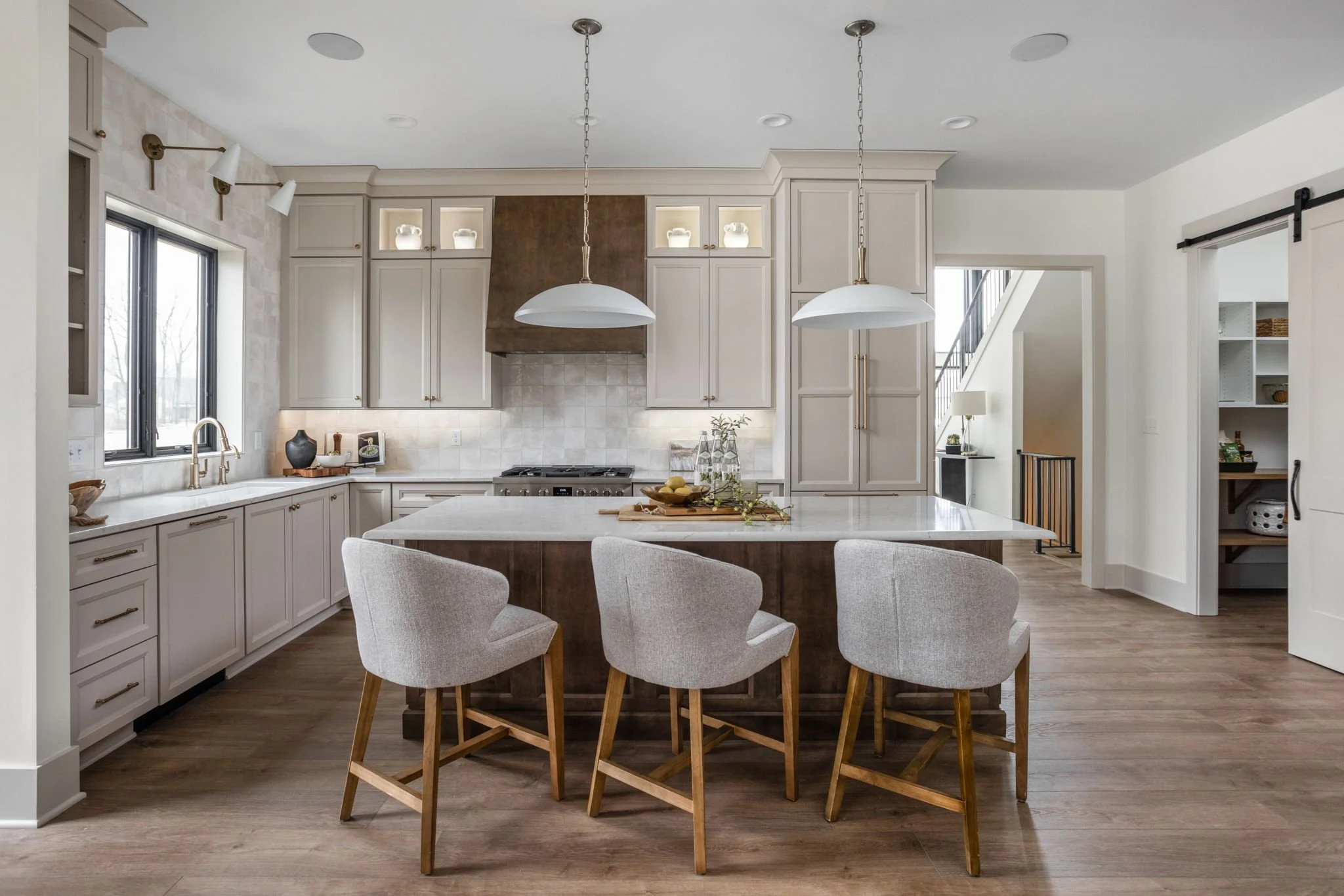 Custom showcase kitchen in Westfield with a large island and statement range hood